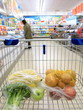 shopping cart with grocery at supermarket