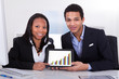Photo: Two Businesspeople Showing Digital Tablet Two Businesspeople Showing Digital Tablet