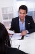 Photo: Businesspeople Discussing In Office Businesspeople Discussing In Office