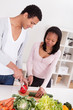 Couple Chopping Vegetables
