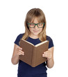 Beautiful little student with glasses reading a book