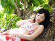beautiful asian woman sleeping on the tree