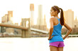Photo: Fitness woman runner relaxing after city running Fitness woman runner relaxing after city running
