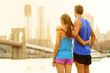 Fitness couple relaxing after running in New York