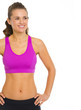 Smiling fitness young woman looking on copy space