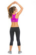 Full length portrait of fitness young woman . rear view
