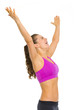 Happy fitness young woman rejoicing success