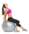 Fitness young woman on fitness ball making exercise