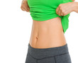Foto: Closeup on tummy of fitness woman Closeup on tummy of fitness woman
