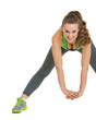 Happy fitness young woman stretching