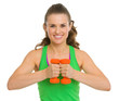 Portrait of happy fitness young woman with dumbbells