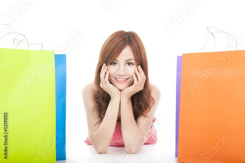 Photo: smiling young woman with shopping bags smiling young woman with shopping bags