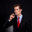 business man prepares to smoke