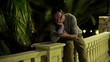 Sad, depressed young man waiting for someone in the night