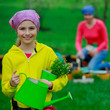 Gardening - young girl helping in the garden