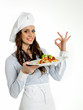 Smiling chef with a dish of  italian spaghetti