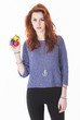 Pretty young female juggling balls
