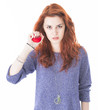 Mad and upset young woman holding red ball