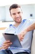 Photo: Man relaxing with digital tablet Man relaxing with digital tablet