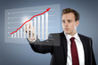Photo: Man touching display with Chart Man touching display with Chart