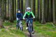Healthy lifestyle - teenage girl and boy biking