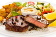 Photo: Grilled steak, baked potatoes and vegetables Grilled steak, baked potatoes and vegetables