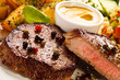 Photo: Grilled steak, baked potatoes and vegetables Grilled steak, baked potatoes and vegetables