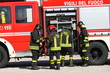 Firefighters prepare for the tools from the truck during a serio