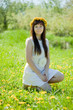 Smiling girl sitting outdoor
