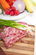 Foto: chopping fresh pork ribs and vegetables chopping fresh pork ribs and vegetables