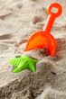 Children's beach toys on sand