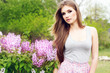 young woman with lilac flowers