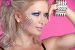 Beautiful woman with hair styling and evening make-up. Jewelry a