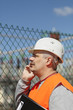 Engineer with a folder in factory site