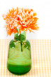 Photo: Orange chrysanthemums in a green vase Orange chrysanthemums in a green vase