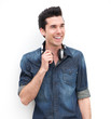 Portrait of a handsome young man smiling with headphones
