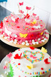 white and pink Marzipan cakes on kitchen dresser