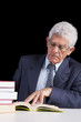 Photo: Senior businessman reading a book Senior businessman reading a book