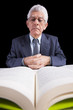 Senior businessman reading a book