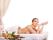 Woman getting spa treatment outdoor.