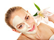 Foto: Woman with facial mask. Woman with facial mask.