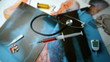 Syringe falling over x ray next to medical tools