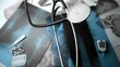 Stethoscope falling over x ray beside other medical tools in black and white