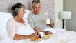Mature couple having breakfast together