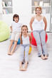 Woman and kids exercising at home