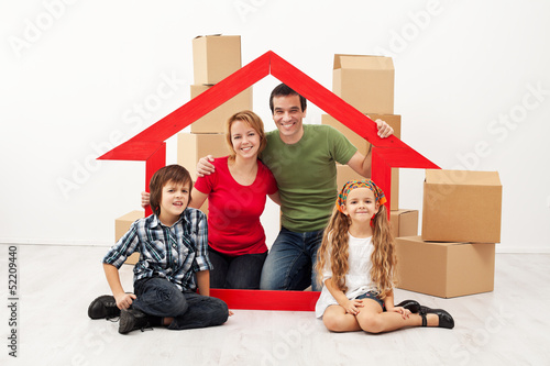 Photo: Happy family with kids moving into a new home Happy family with kids moving into a new home