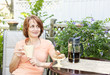 Woman relaxing in backyard