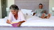 Mature couple reading in the bedroom