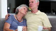 Mature couple sitting on the couch talking together