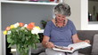 Woman reading a book on the couch